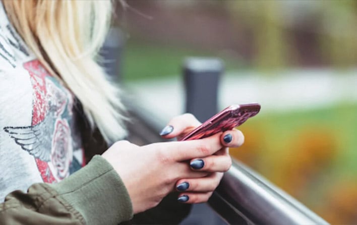 Student holding a phone 